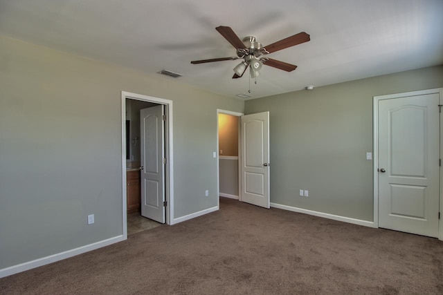 unfurnished bedroom featuring ceiling fan, connected bathroom, and light carpet