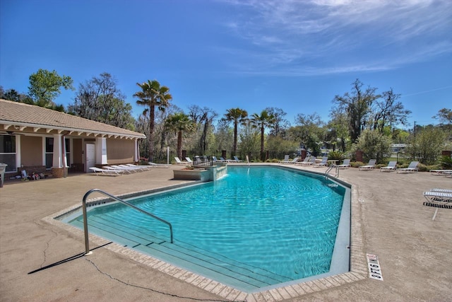 view of swimming pool featuring a patio area