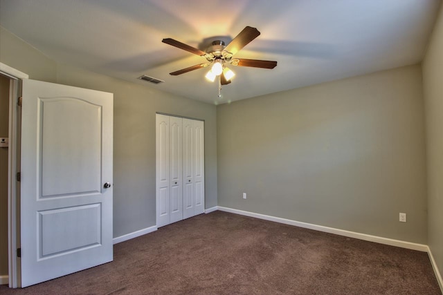 unfurnished bedroom featuring ceiling fan and carpet floors