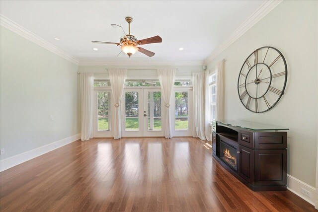 3621 Moody Trl, Tallahassee, FL 32309 - unfurnished living room featuring french doors, a ceiling fan, wood finished floors, baseboards, and a glass covered fireplace