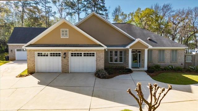 3621 Moody Trl, Tallahassee, FL 32309 - view of front of property with concrete driveway, brick siding, and an attached garage