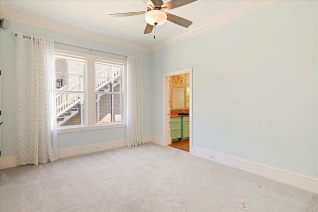 3621 Moody Trl, Tallahassee, FL 32309 - empty room featuring ornamental molding, light carpet, baseboards, and a ceiling fan