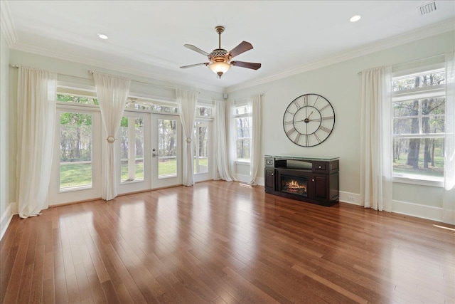 3621 Moody Trl, Tallahassee, FL 32309 - unfurnished living room featuring french doors, plenty of natural light, hardwood / wood-style flooring, ornamental molding, and recessed lighting