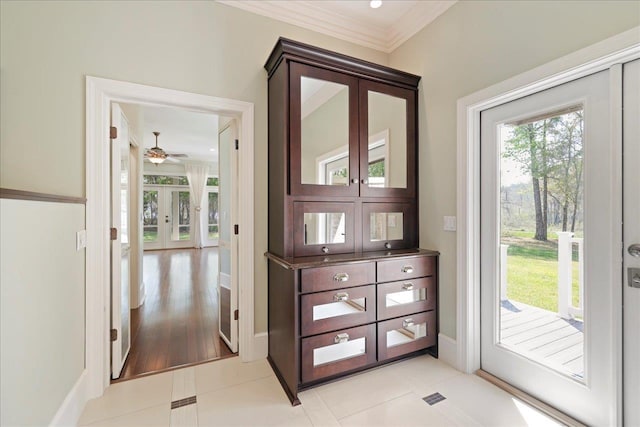 3621 Moody Trl, Tallahassee, FL 32309 - entryway with baseboards, ornamental molding, a ceiling fan, and light tile patterned flooring