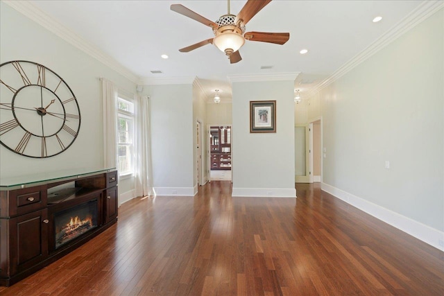 3621 Moody Trl, Tallahassee, FL 32309 - unfurnished living room featuring dark wood-style flooring, a glass covered fireplace, ceiling fan, ornamental molding, and baseboards