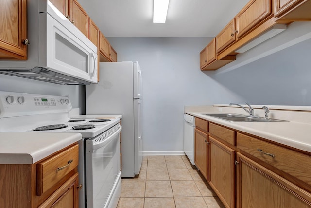 2738 W Tharpe St Unit 806, Tallahassee, FL 32303 - kitchen featuring white appliances, light countertops, brown cabinetry, and light tile patterned floors
