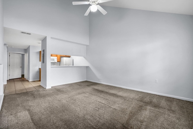 2738 W Tharpe St Unit 806, Tallahassee, FL 32303 - unfurnished living room with carpet, a ceiling fan, high vaulted ceiling, and tile patterned flooring