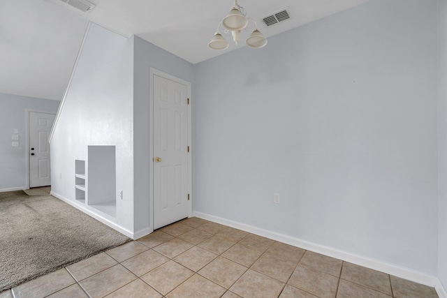 2738 W Tharpe St Unit 806, Tallahassee, FL 32303 - unfurnished room with a chandelier and light tile patterned flooring