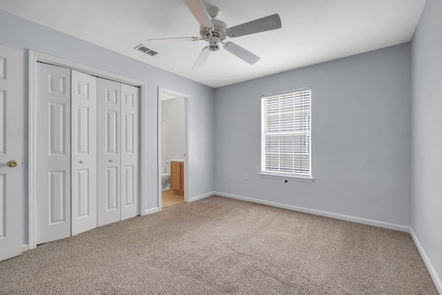 2738 W Tharpe St Unit 806, Tallahassee, FL 32303 - unfurnished bedroom featuring light colored carpet, a closet, ceiling fan, and ensuite bathroom