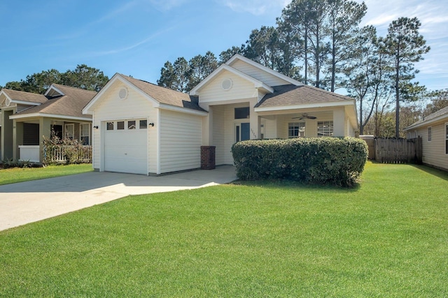 view of front facade with a garage, fence, a ceiling fan, concrete driveway, and a front lawn