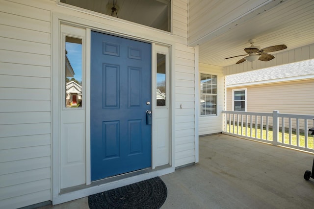 property entrance with covered porch and ceiling fan