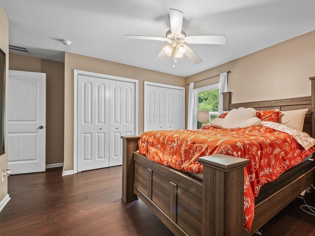100 Ej Stringer Rd, Crawfordville, FL 32327 - bedroom featuring two closets, dark wood-style flooring, and ceiling fan