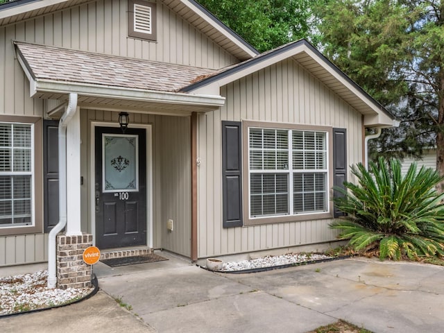 100 Ej Stringer Rd, Crawfordville, FL 32327 - doorway to property featuring roof with shingles