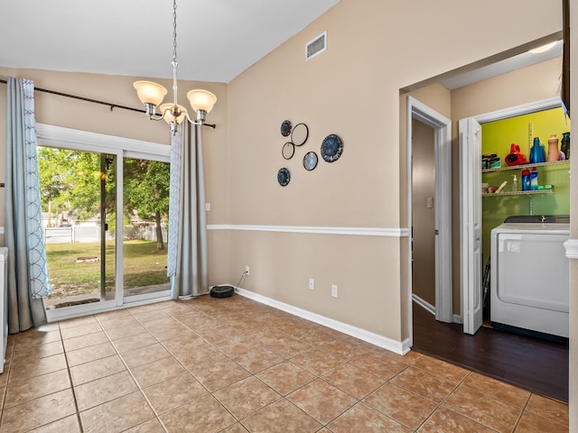 100 Ej Stringer Rd, Crawfordville, FL 32327 - unfurnished dining area featuring light tile patterned flooring, a chandelier, and vaulted ceiling