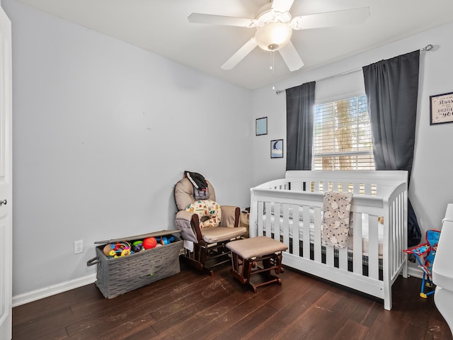 100 Ej Stringer Rd, Crawfordville, FL 32327 - bedroom featuring hardwood / wood-style flooring, a nursery area, and ceiling fan
