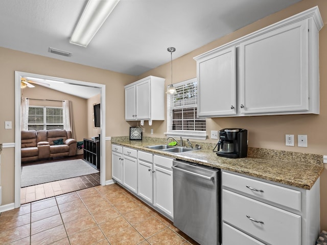 100 Ej Stringer Rd, Crawfordville, FL 32327 - kitchen featuring stainless steel dishwasher, white cabinets, hanging light fixtures, ceiling fan, and light tile patterned flooring