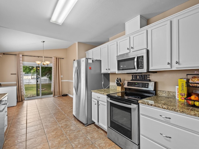 100 Ej Stringer Rd, Crawfordville, FL 32327 - kitchen with appliances with stainless steel finishes, white cabinets, a chandelier, and lofted ceiling