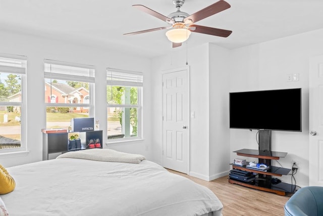 bedroom featuring ceiling fan and light hardwood / wood-style flooring