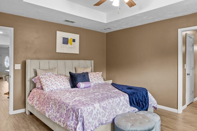 bedroom featuring ceiling fan and light wood-type flooring