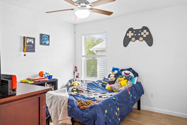 bedroom with ceiling fan and light hardwood / wood-style flooring