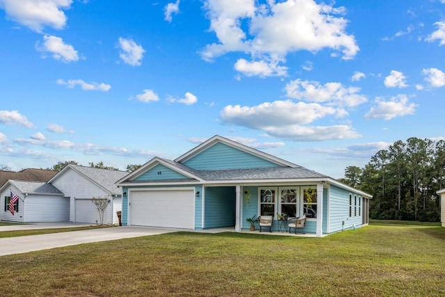 view of front of home with a garage and a front lawn