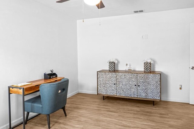 office area with wood-type flooring and ceiling fan