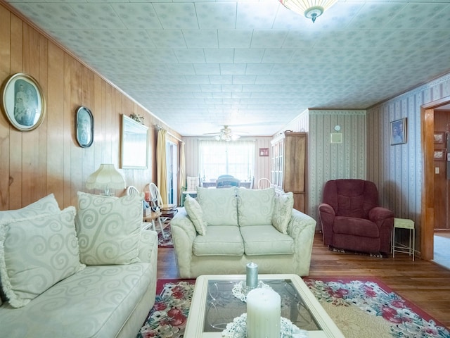 3364 NW 66th Blvd, Jennings, FL 32053 - living room with hardwood / wood-style floors, a ceiling fan, wood walls, and crown molding