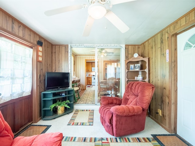 3364 NW 66th Blvd, Jennings, FL 32053 - carpeted living area with wood walls and ceiling fan