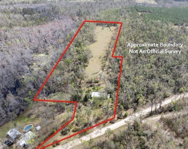 3364 NW 66th Blvd, Jennings, FL 32053 - aerial overview of property's location with property parcel outlined and a forest