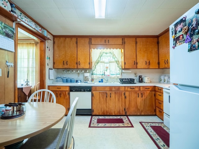 3364 NW 66th Blvd, Jennings, FL 32053 - kitchen with white appliances, light countertops, and healthy amount of natural light