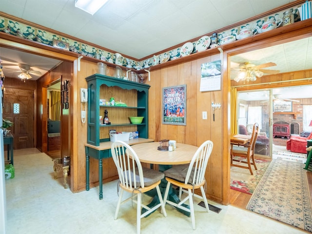3364 NW 66th Blvd, Jennings, FL 32053 - dining room featuring a ceiling fan and wooden walls