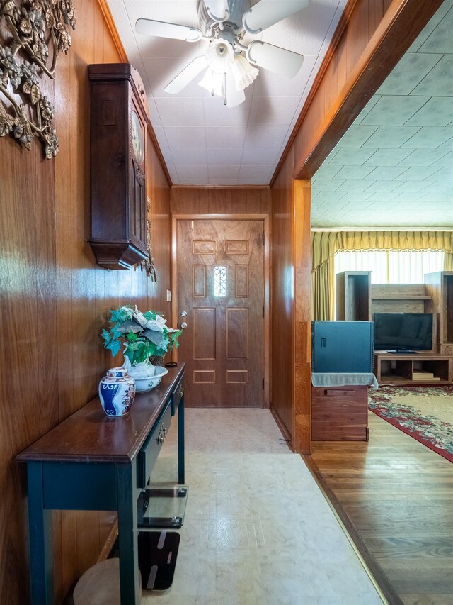 3364 NW 66th Blvd, Jennings, FL 32053 - entrance foyer with wood walls and a ceiling fan
