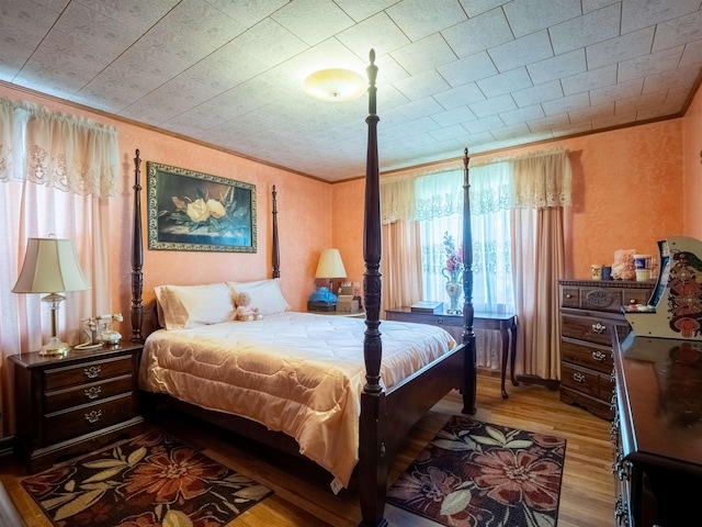 3364 NW 66th Blvd, Jennings, FL 32053 - bedroom with multiple windows, wood finished floors, and ornamental molding