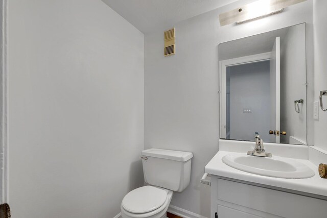 2263 Shady Timbers Cir Unit 3, Tallahassee, FL 32304 - half bath with visible vents, toilet, baseboards, and vanity