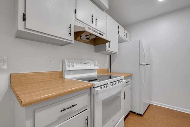 2263 Shady Timbers Cir Unit 3, Tallahassee, FL 32304 - kitchen with white cabinets, under cabinet range hood, light countertops, white appliances, and light wood-style flooring