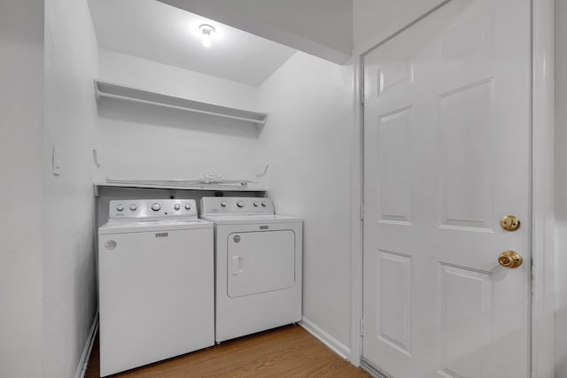 2263 Shady Timbers Cir Unit 3, Tallahassee, FL 32304 - laundry area featuring separate washer and dryer, baseboards, light wood-style floors, and laundry area