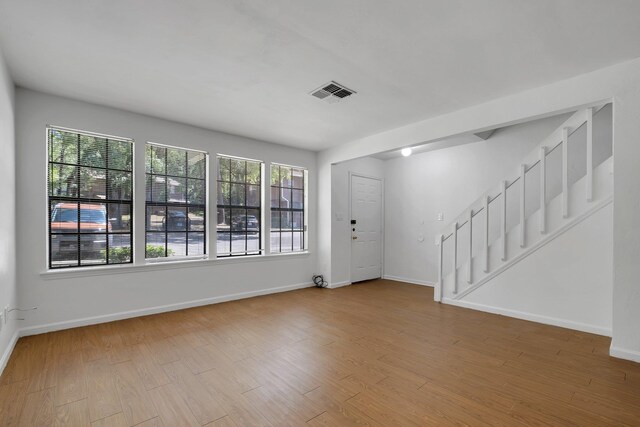2263 Shady Timbers Cir Unit 3, Tallahassee, FL 32304 - interior space featuring baseboards, wood finished floors, visible vents, and stairway