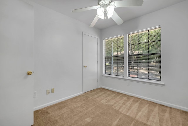 2263 Shady Timbers Cir Unit 3, Tallahassee, FL 32304 - empty room featuring light carpet, a ceiling fan, and baseboards