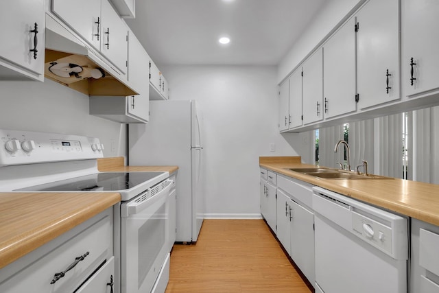 2263 Shady Timbers Cir Unit 3, Tallahassee, FL 32304 - kitchen featuring white cabinets, a sink, light wood-style floors, white appliances, and light countertops