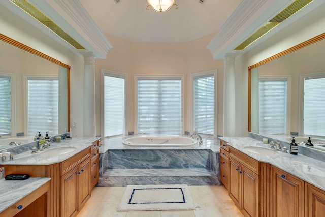 3899 W Millers Bridge Rd, Tallahassee, FL 32312 - full bathroom with decorative columns, two vanities, a bath, and tile patterned flooring