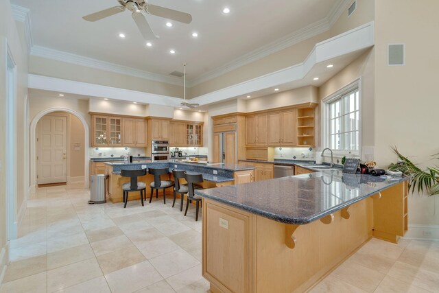 3899 W Millers Bridge Rd, Tallahassee, FL 32312 - kitchen with a kitchen bar, stainless steel appliances, ornamental molding, open shelves, and a peninsula