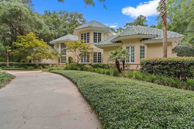 3899 W Millers Bridge Rd, Tallahassee, FL 32312 - mediterranean / spanish home with a tile roof and stucco siding