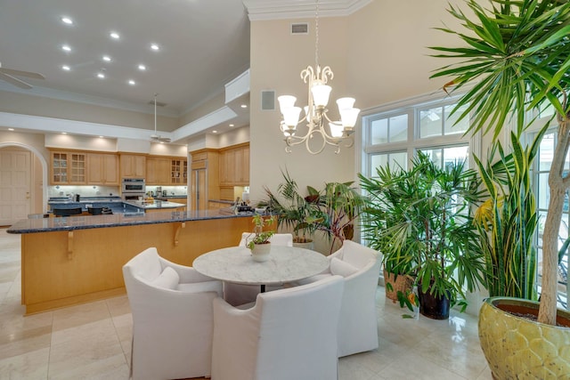3899 W Millers Bridge Rd, Tallahassee, FL 32312 - dining area featuring ornamental molding, a chandelier, light tile patterned floors, a towering ceiling, and recessed lighting