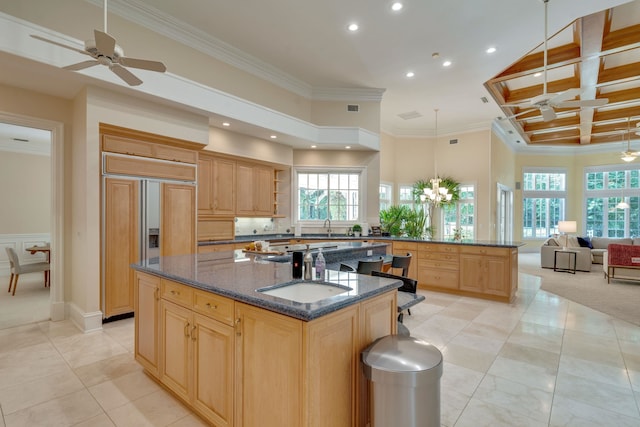 3899 W Millers Bridge Rd, Tallahassee, FL 32312 - kitchen featuring ornamental molding, paneled built in refrigerator, light brown cabinetry, recessed lighting, and a kitchen island