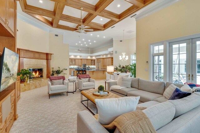 3899 W Millers Bridge Rd, Tallahassee, FL 32312 - living room featuring a high ceiling, ceiling fan, beam ceiling, light carpet, and a fireplace