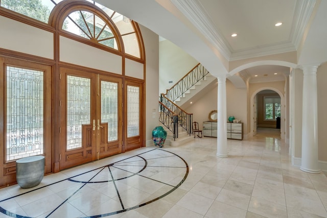 3899 W Millers Bridge Rd, Tallahassee, FL 32312 - foyer featuring decorative columns, french doors, stairway, arched walkways, and ornamental molding