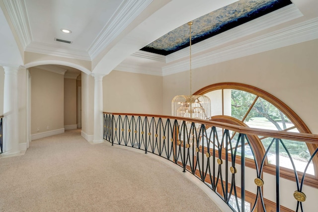 3899 W Millers Bridge Rd, Tallahassee, FL 32312 - hallway with a chandelier, carpet, ornamental molding, a tray ceiling, and decorative columns