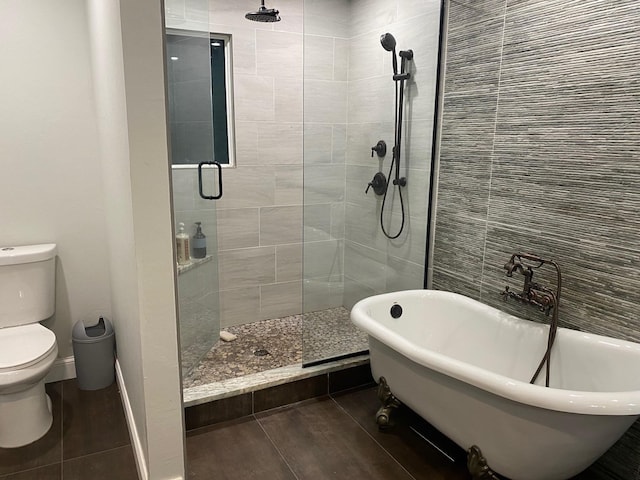 bathroom with toilet and separate shower and tub