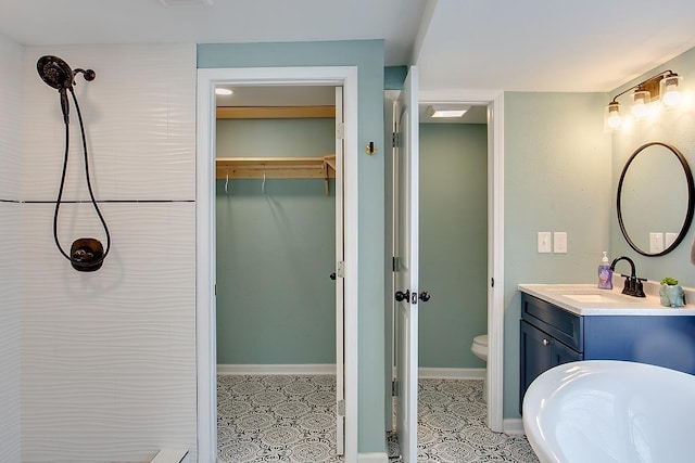 bathroom featuring toilet and vanity