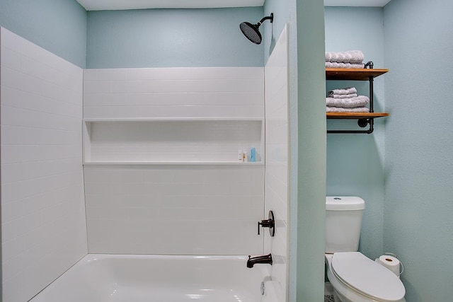 bathroom featuring shower / bathing tub combination and toilet